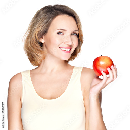 Photo: Portrait of a young smiling healthy woman with apple Portrait of a young smiling healthy woman with apple