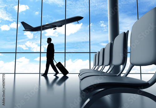 Photo: businessman walking in airport businessman walking in airport