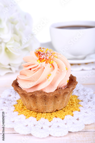Photo: Tasty cake on table on light background Tasty cake on table on light background
