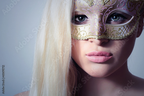 Photo: Beautiful Blond Woman in a Carnival Mask.Masquerade.Sexy Girl Beautiful Blond Woman in a Carnival Mask.Masquerade.Sexy Girl