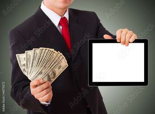 Photo: Businessman giving cash dollars in the hands Businessman giving cash dollars in the hands