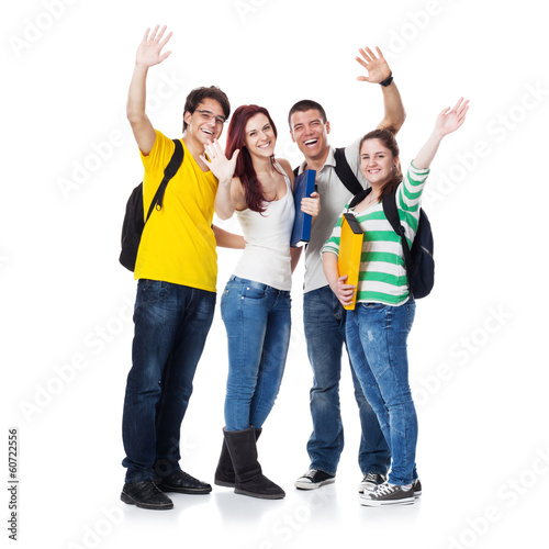 Photo: Four Students smiling and hand wave Four Students smiling and hand wave