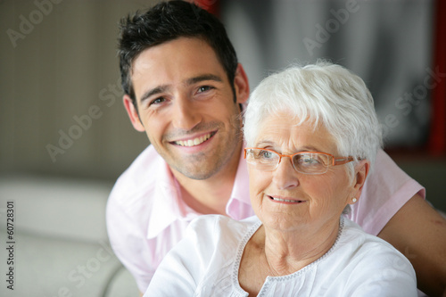 Photo: Old lady and her grandson spending time together Old lady and her grandson spending time together