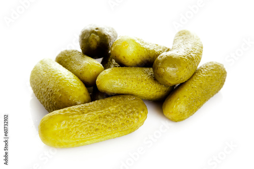 Photo: pickled cucumbers. Gherkins on a white background pickled cucumbers. Gherkins on a white background