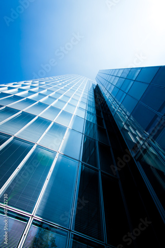 Photo: office buildings. modern glass silhouettes of skyscrapers office buildings. modern glass silhouettes of skyscrapers