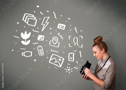 Photo: Photographer girl capturing white photography icons and symbols Photographer girl capturing white photography icons and symbols
