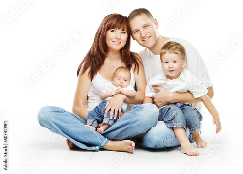 Photo: Young family four persons, smiling father mother and two childre Young family four persons, smiling father mother and two childre