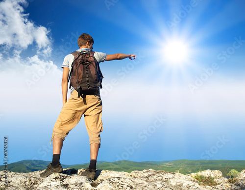 Photo: Tourist on the mountain top. Sport concept Tourist on the mountain top. Sport concept