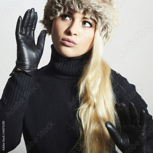 Photo: Beauty Girl in Fur Hat.Beautiful Blond Woman in Leather Gloves Beauty Girl in Fur Hat.Beautiful Blond Woman in Leather Gloves