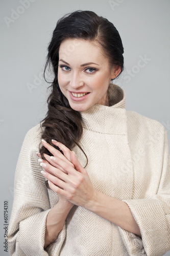 Photo: Beautiful young woman in autumn coat Beautiful young woman in autumn coat