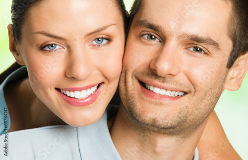 Photo: Young happy smiling attractive couple, outdoors Young happy smiling attractive couple, outdoors