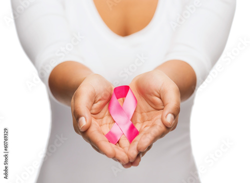 Photo: hands holding pink breast cancer awareness ribbon hands holding pink breast cancer awareness ribbon