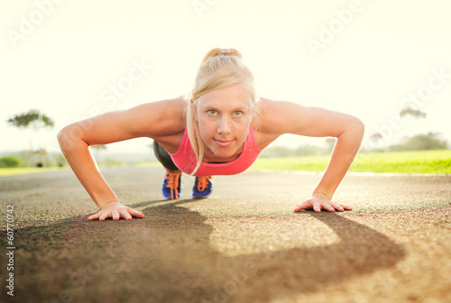 Photo: Attractive young woman doing push up Attractive young woman doing push up