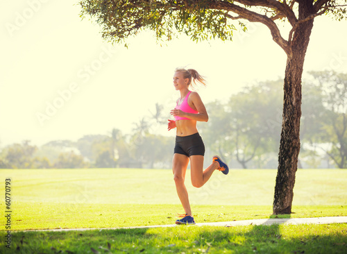 Photo: Young woman jogging running outdoors Young woman jogging running outdoors