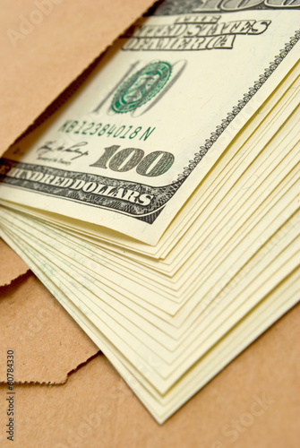 Photo: Dollars in an envelope. Dollars in an envelope.