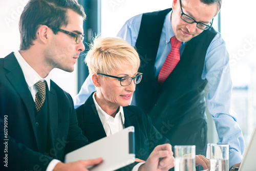 Photo: Business - meeting in office, people working with document Business - meeting in office, people working with document
