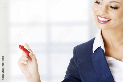 Photo: Writing with a pen on abstract screen Writing with a pen on abstract screen