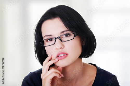 Photo: Young beautiful woman in casual clothes thinking Young beautiful woman in casual clothes thinking