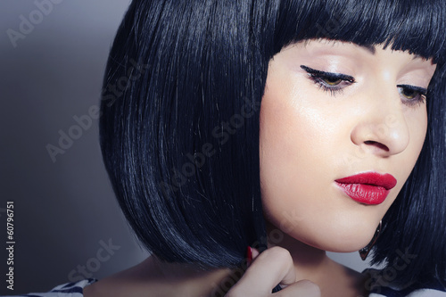 Photo: Beautiful Brunette young Woman. Healthy Black Hair.red lips Beautiful Brunette young Woman. Healthy Black Hair.red lips