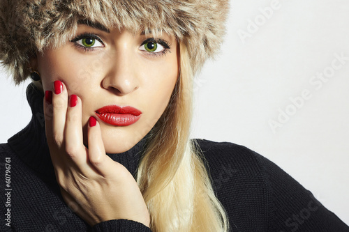 Photo: Beautiful Fashion Blond Woman in Fur. Beauty Girl. Red Manicure Beautiful Fashion Blond Woman in Fur. Beauty Girl. Red Manicure