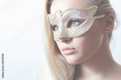 Photo: Beautiful Blond Woman in Mask.Masquerade.Sexy Girl.Lovely Beautiful Blond Woman in Mask.Masquerade.Sexy Girl.Lovely