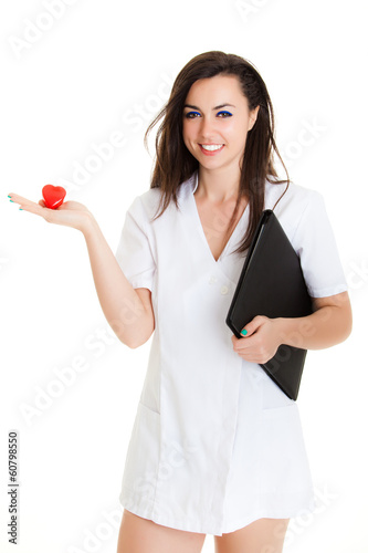 Photo: A female doctor holding a heart, isolated on white background A female doctor holding a heart, isolated on white background
