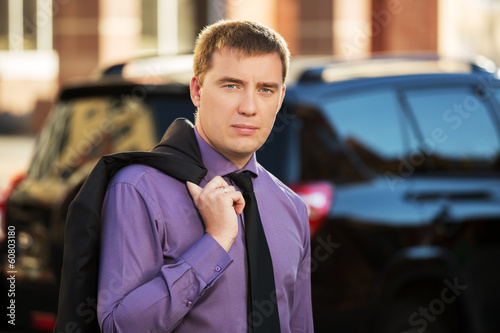 Photo: Young business man on the city street Young business man on the city street