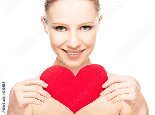 Photo: face of a beautiful young woman with red heart face of a beautiful young woman with red heart