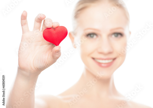Photo: face of a beautiful young woman with red heart face of a beautiful young woman with red heart