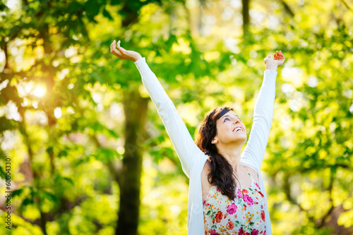 Photo: Blissful woman enjoying freedom on spring Blissful woman enjoying freedom on spring