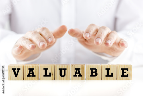 Photo: The word - Valuable- on wooden cubes The word - Valuable- on wooden cubes