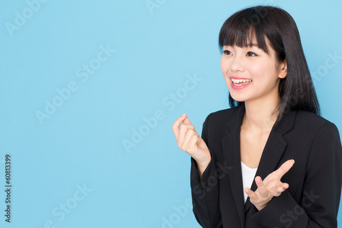 Photo: asian businesswoman interviewing on blue background asian businesswoman interviewing on blue background