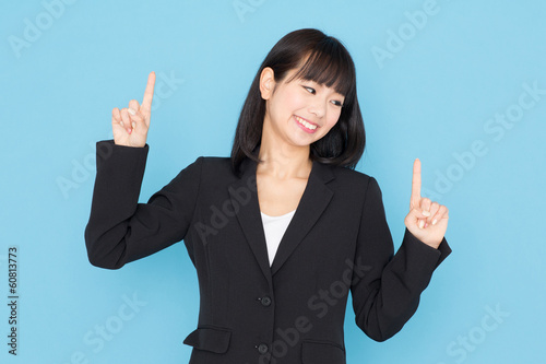 Photo: asian businesswoman on blue background asian businesswoman on blue background