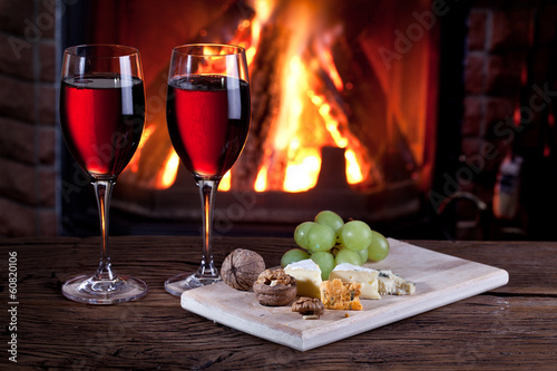 Photo: Glasses of wine, cheese and nuts. Glasses of wine, cheese and nuts.