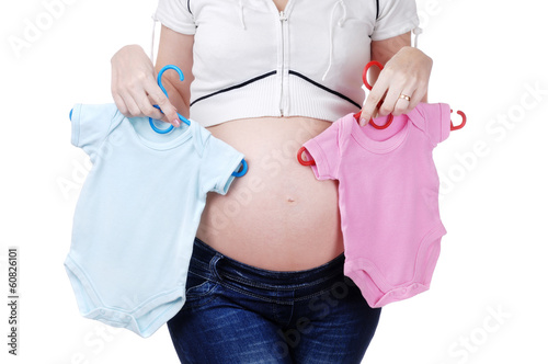 Photo: Pregnant woman choosing bodysuit for a baby girl or boy Pregnant woman choosing bodysuit for a baby girl or boy