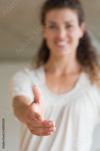 Photo: Smiling businesswoman offering handshake Smiling businesswoman offering handshake