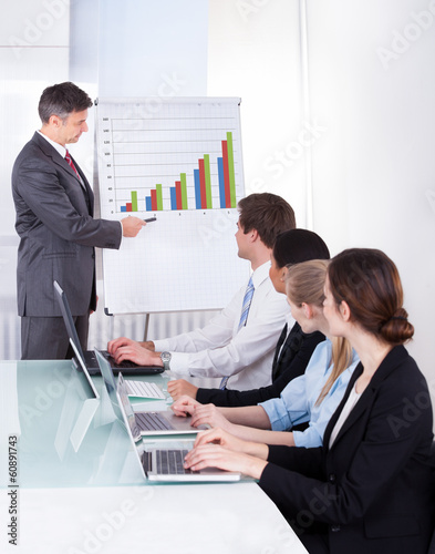 Photo: Business People Discussing Project Business People Discussing Project