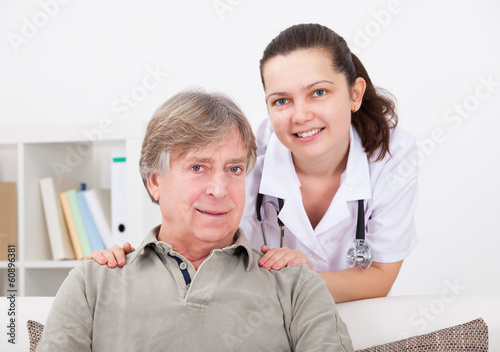 Photo: Female Doctor With Patient Female Doctor With Patient