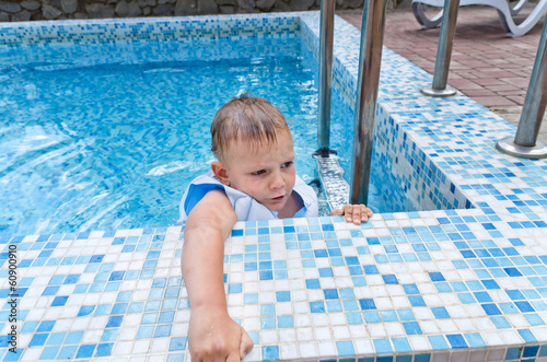 Photo: Young boy in swimming pool Young boy in swimming pool