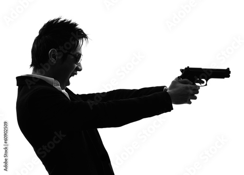 Photo: asian gunman killer portrait shooting silhouette asian gunman killer portrait shooting silhouette