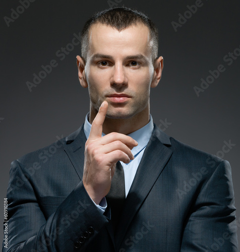 Photo: Portrait of making forefinger gesture manager Portrait of making forefinger gesture manager