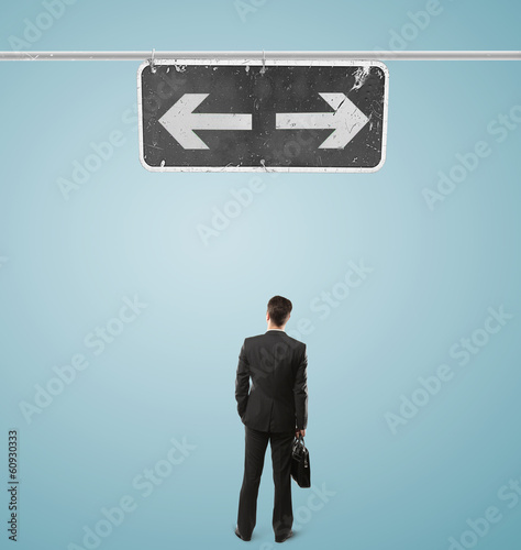 Photo: businessman looking at pointer businessman looking at pointer
