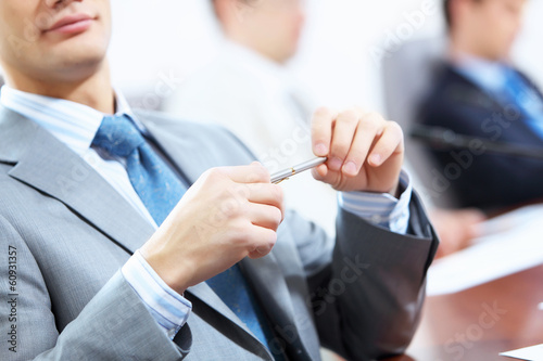 Photo: Three businesspeople at meeting Three businesspeople at meeting