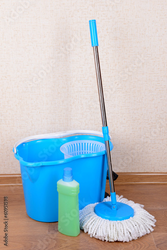 Photo: Different tools for cleaning floor in room Different tools for cleaning floor in room