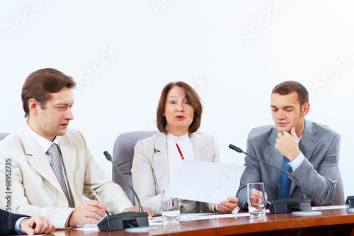 Photo: Four businesspeople at meeting Four businesspeople at meeting