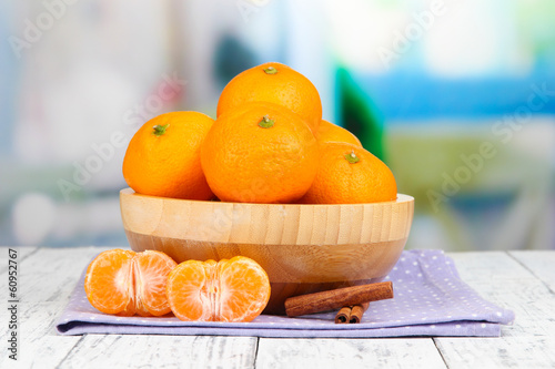 Photo: Ripe sweet tangerines with spices in bowl, Ripe sweet tangerines with spices in bowl,