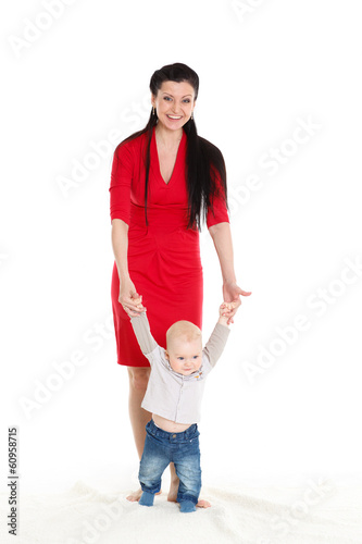 Photo: Mother with baby. First steps. Mother with baby. First steps.
