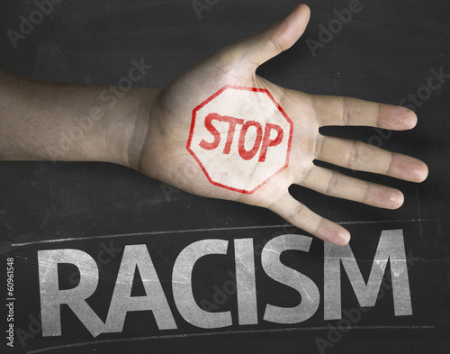 Photo: Educational composition with a hand painted Stop Racism Educational composition with a hand painted Stop Racism