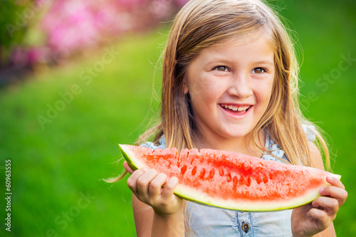 Photo: cute little girl eating watermelon cute little girl eating watermelon