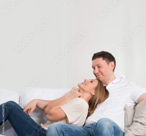Photo: Young couple on the sofa in love Young couple on the sofa in love